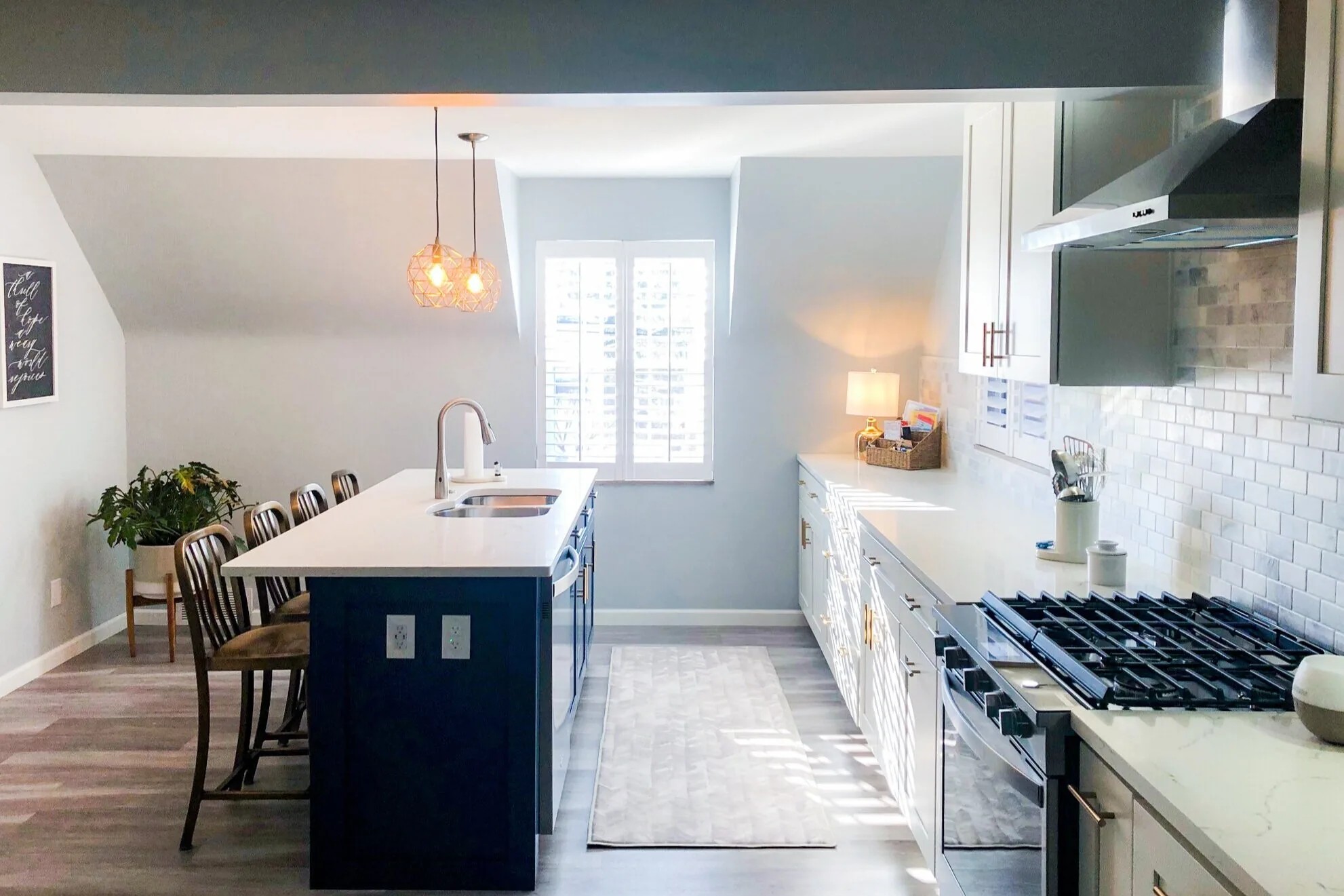Kitchen completed by BKG Design in McCandless, PA, with a navy island and white perimeter cabinets